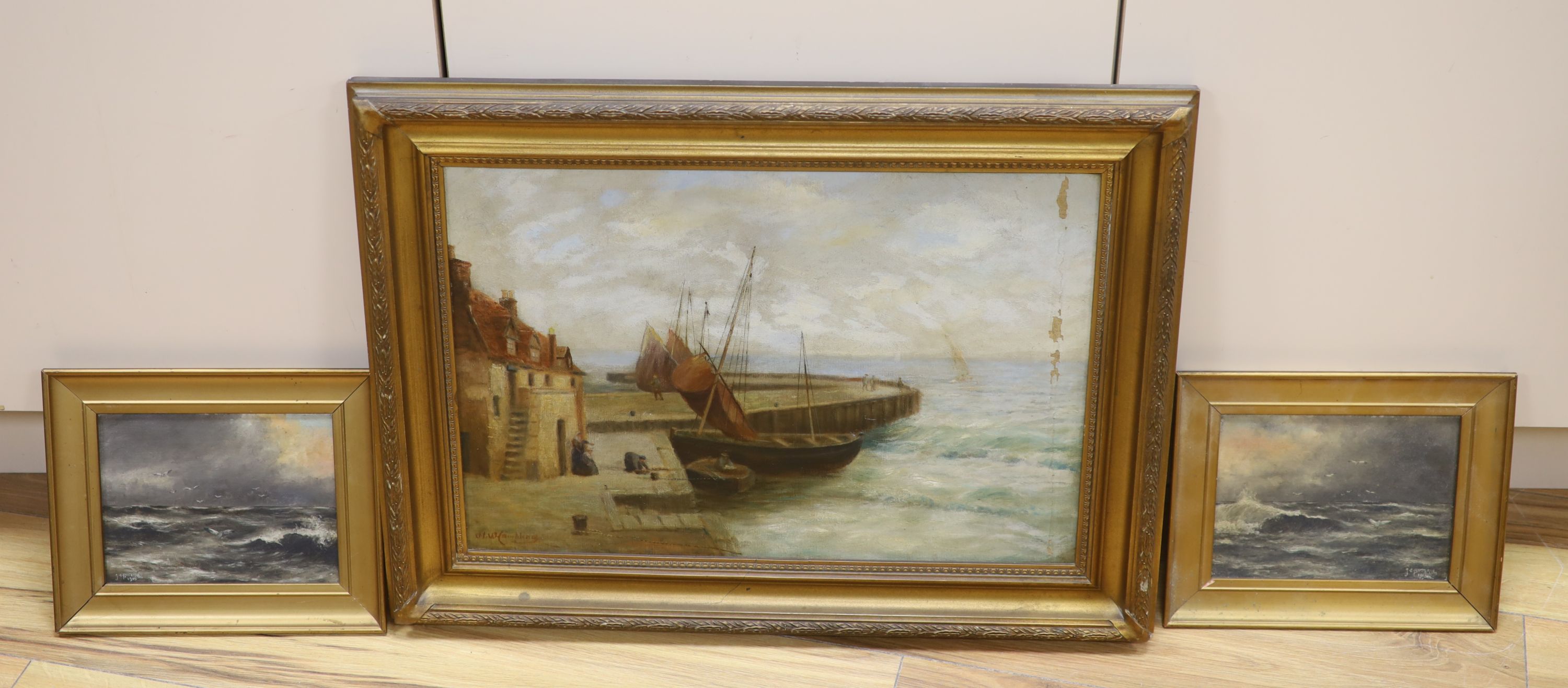 J.H. Hambling, oil on canvas, Fishing boats in harbour, signed, 35 x 49cm and a pair of seascapes by J.E. Botterill, 1915, 14 x 19cm